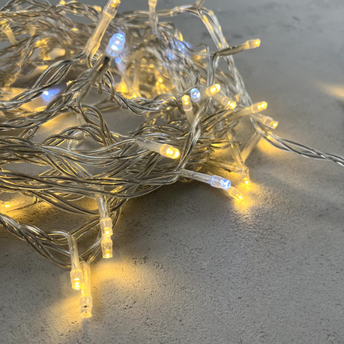 Светодиодная нить 100 теплых белых LED ламп с мерцанием, 10 м., 24В, прозрачный провод ПВХ, LTC (PST100BLW-10-1WW)