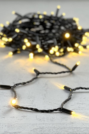 Светодиодная гирлянда с колпачком 100 теплых белых LED ламп 10 м., 24В., черный провод ПВХ, IP65, LTC (PST100CAP-11-1WW)