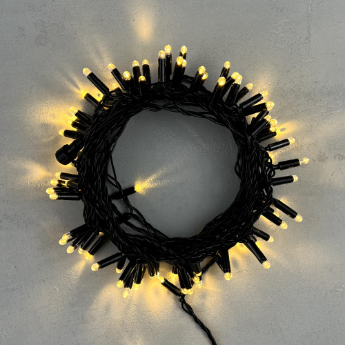 Светодиодная гирлянда с колпачком 100 теплых белых LED ламп 10 м., 24В., черный провод ПВХ, IP65, LTC (PST100CAP-11-1WW)