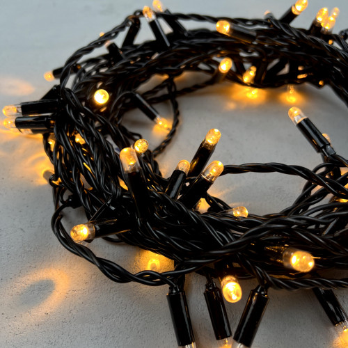Светодиодная гирлянда с колпачком 100 экстра теплых белых LED ламп 10 м., 24В., черный провод ПВХ, IP65, LTC (PST100CAP-11-1EWW)