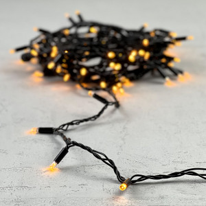 Светодиодная гирлянда с колпачком 100 желтых LED ламп 10 м., 24В., черный провод ПВХ, IP65, LTC (PST100CAP-11-1Y)