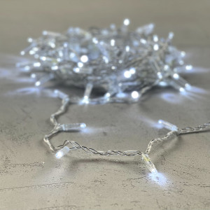 Светодиодная гирлянда с колпачком 100 холодных белых LED ламп 10 м., 24В., прозрачный провод ПВХ, IP65, LTC (PST100CAP-10-1W)