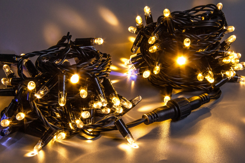  Светодиодная нить 100 теплых белых LED ламп, 10 м., 220В, мерцание, черный резиновый провод 2,3 мм., Teamprof (TPF-S10CF-220V-SRB/WW)