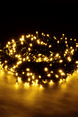 Светодиодная нить 200 теплых белых LED ламп, 20 м., 220В, 8 режимов, зеленый провод, Vegas (55068)