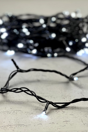 Светодиодная нить 100 холодных белых LED ламп с мерцанием, 10 м., 24В., черный провод ПВХ, LTC (PST100BLW-11-1W)