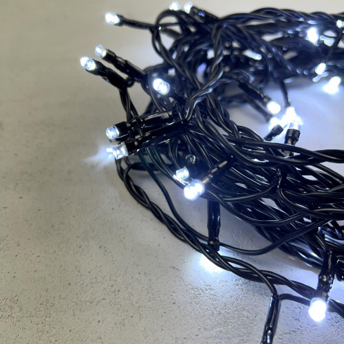 Светодиодная нить 100 холодных белых LED ламп с мерцанием, 10 м., 24В., черный провод ПВХ, LTC (PST100BLW-11-1W)